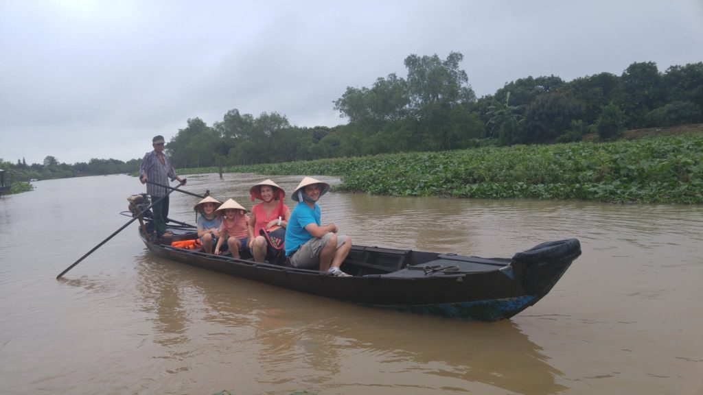 cruising through a canal in Caibe Mekong delta