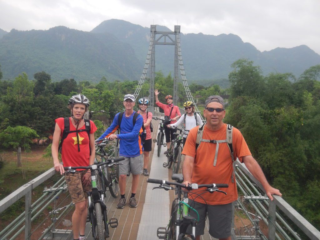 Riding bicycle through Chay village in Phong Nha National Park